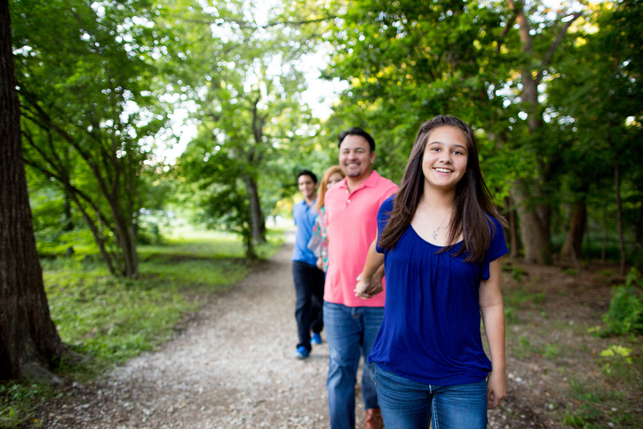 Family walking on a nature trail near Mt. Juliet, TN enjoying outdoor activities and scenic views during a vacation