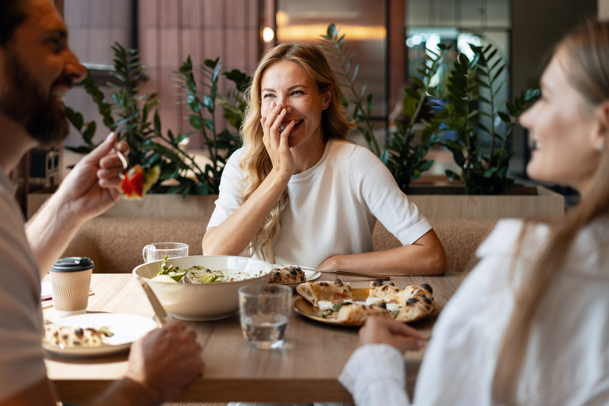 Friends enjoying dinner at a restaurant